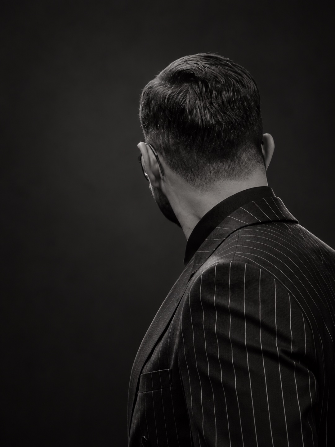 Studio edit of Yiğit Akalın’s pinstripe jacket and rear profile